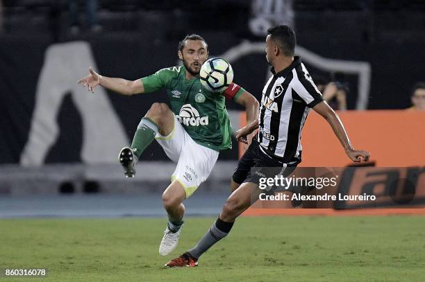 Rodrigo Lindoso of Botafogo battles for the ball with Apodi of Chapecoense during the match between Botafogo and Chapecoense as part of Brasileirao...