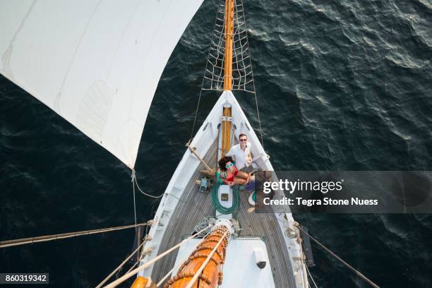 friends on bow of large sailboat from above - tall ship stock pictures, royalty-free photos & images