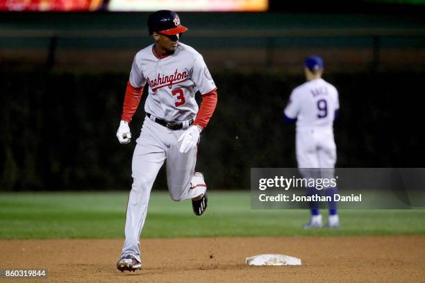 Michael A. Taylor of the Washington Nationals rounds the bases after hitting a grand slam in the eighth inning during game four of the National...