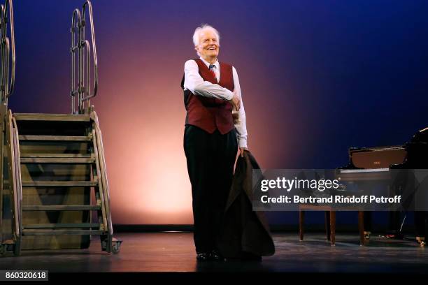 Actor Andre Dussollier acknowledges the applause of the audience at the end of the "Novecento" Theater Play in support of APREC at Theatre...