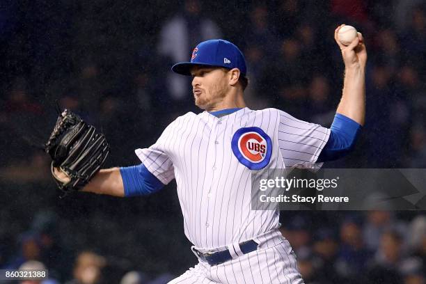 Justin Wilson of the Chicago Cubs pitches in the ninth inning during game four of the National League Division Series against the Washington...