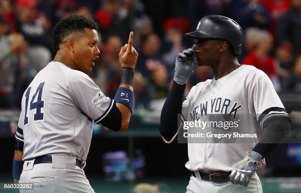Didi Gregorius of the New York Yankees celebrates his solo homerun with Starlin Castro in the first inning against the Cleveland Indians in game five...