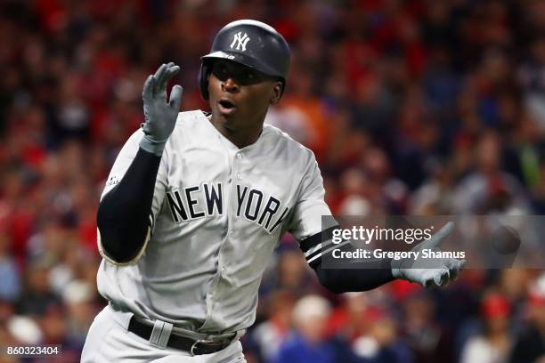 Didi Gregorius of the New York Yankees celebrates as he runs the bases after hitting a solo homerun in the first inning against the Cleveland Indians...