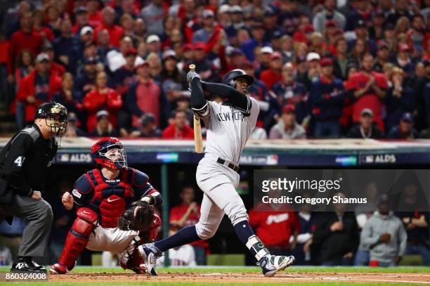 Didi Gregorius of the New York Yankees hits a solo homerun in the first inning against the Cleveland Indians in game five of the American League...