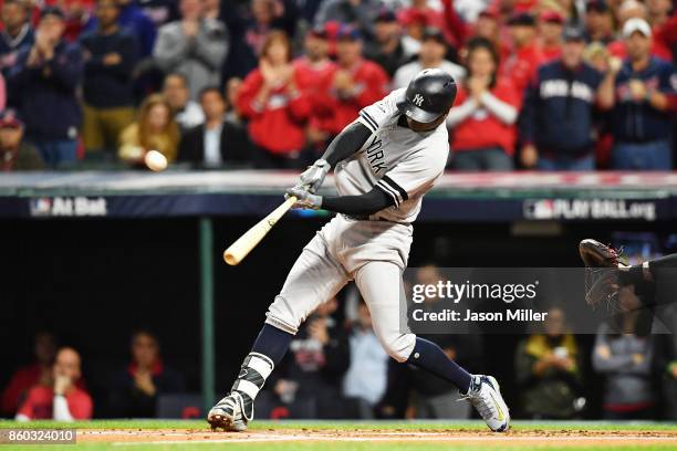 Didi Gregorius of the New York Yankees hits a solo homerun in the first inning against the Cleveland Indians in game five of the American League...