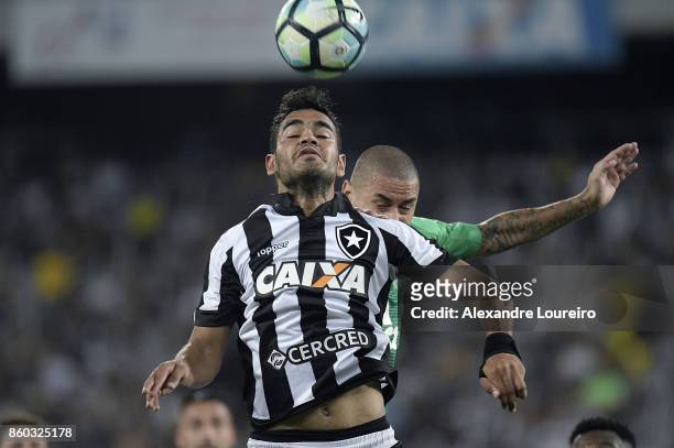 Brenner of Botafogo battles for the ball with Wellington Paulista of Chapecoense during the match between Botafogo and Chapecoense as part of...
