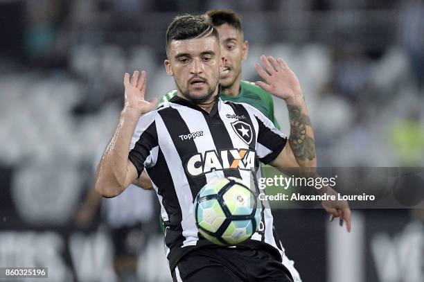 Victor Luis of Botafogo battles for the ball with Alan Ruschel of Chapecoense during the match between Botafogo and Chapecoense as part of...