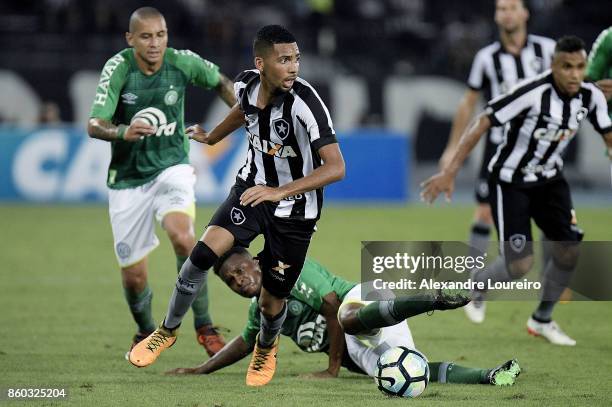 Matheus Fernandes of Botafogo battles for the ball with MoisÃ©s Ribeiro of Chapecoense during the match between Botafogo and Chapecoense as part of...