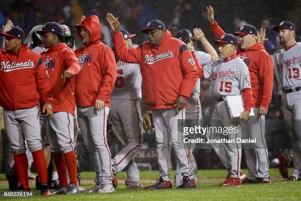 Manager Dusty Baker of the Washington Nationals celebrates with his team after defeating the Chicago Cubs 5-0 in game four of the National League...