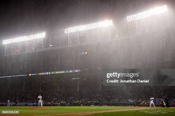 Rain falls in the eighth inning during game four of the National League Division Series between the Washington Nationals and the Chicago Cubs at...