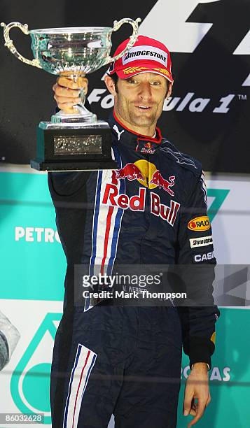 Second placed Mark Webber of Australia and Red Bull Racing celebrates on the podium after the Chinese Formula One Grand Prix at the Shanghai...