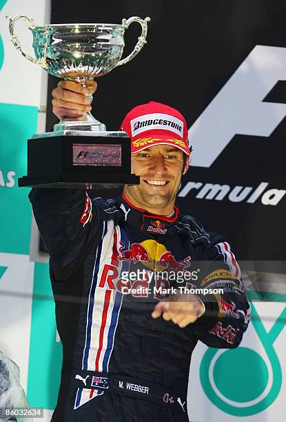 Second placed Mark Webber of Australia and Red Bull Racing celebrates on the podium after the Chinese Formula One Grand Prix at the Shanghai...