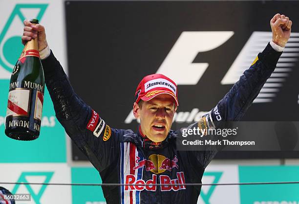 Second placed Mark Webber of Australia and Red Bull Racing celebrates on the podium after the Chinese Formula One Grand Prix at the Shanghai...