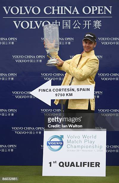 Scott Strange of Australia celebrates with the trophy after winning the final round of the Volvo China Open at the Beijing CBD International Golf...