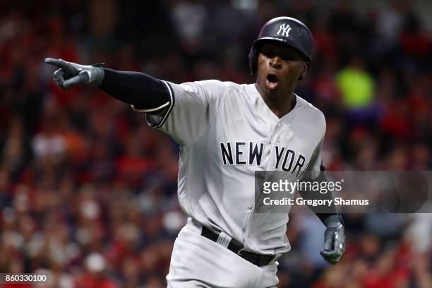Didi Gregorius of the New York Yankees celebrates his two-run homerun as he runs the bases in the third inning against the Cleveland Indians in game...