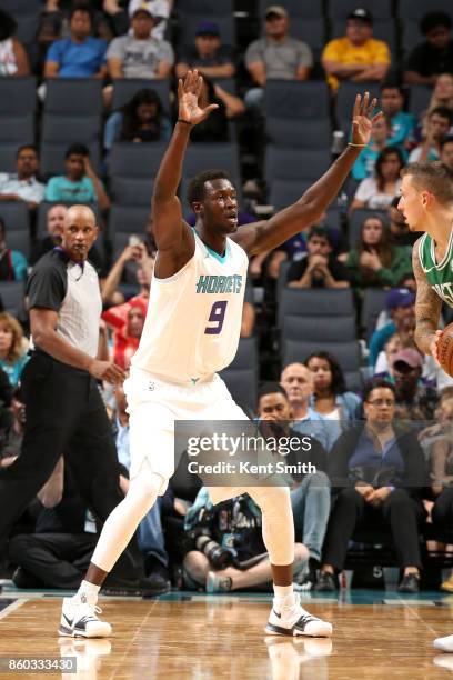 Mangok Mathiang of the Charlotte Hornets plays defense against the Boston Celtics on October 11, 2017 at Spectrum Center in Charlotte, North...