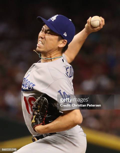 Relief pitcher Kenta Maeda of the Los Angeles Dodgers throws during the eighth inning of the National League Divisional Series game three against the...