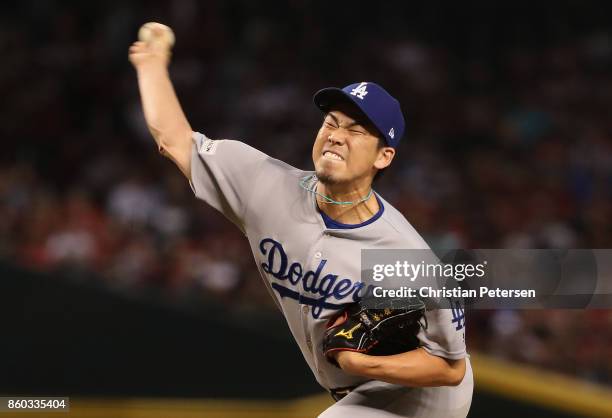 Relief pitcher Kenta Maeda of the Los Angeles Dodgers throws during the eighth inning of the National League Divisional Series game three against the...