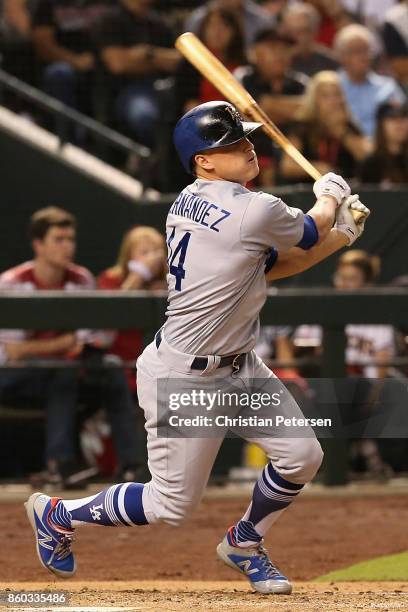 Enrique Hernandez of the Los Angeles Dodgers hits a ground rule double during the sixth inning of the National League Divisional Series game three...