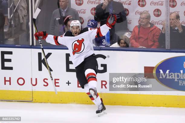 New Jersey Devils left wing Brian Gibbons celebrates after scoring a shorthanded goal as the Toronto Maple Leafs play the New Jersey Devils in...