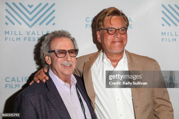 California Film Institute Founder and Director Mark Fishkin poses for photos with director Aaron Sorkin on the red carpet for "Molly's Game" during...