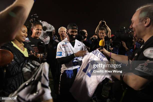 House Majority Whip Rep. Steve Scalise presents a "THANK YOU" jersey to officers David Bailey and Crystal Griner , who were part of his security...