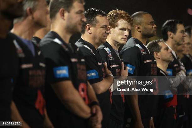 Rep. Joe Kennedy listens to the national anthem with other team members of the Mean Machine during pregame of 2017 Congressional Football Game...