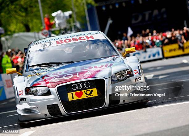 An Audi DTM racing car is seen in action during the DTM German Touring Car official presentation at the Koenigsallee on April 19, 2009 in...