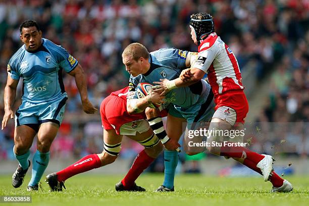 Gethin Jenkins of Cardiff is tackled by Luke Narraway of Gloucester during the EDF Energy Cup Final between Gloucester and Cardiff Blues at...