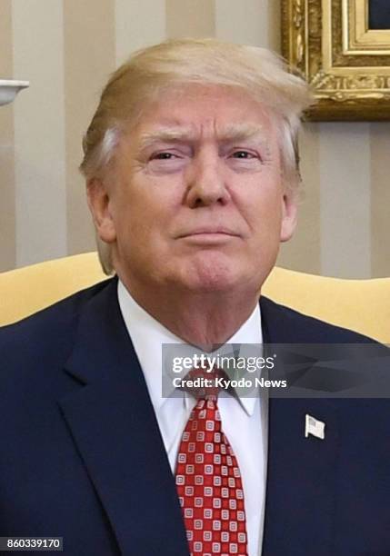 President Donald Trump, seen in this file photo, denied a media report on Oct. 11, 2017 that he told senior national security officials in July he...