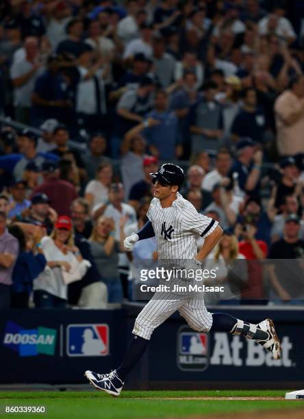 Greg Bird of the New York Yankees runs the bases after his seventh inning home run against the Cleveland Indians in Game Three of the American League...