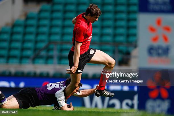 Jonny May of Hartpury goes through the challenge from David Rees of Clifton during the EDF Energy Intermediate Cup Final between Hartpury College and...