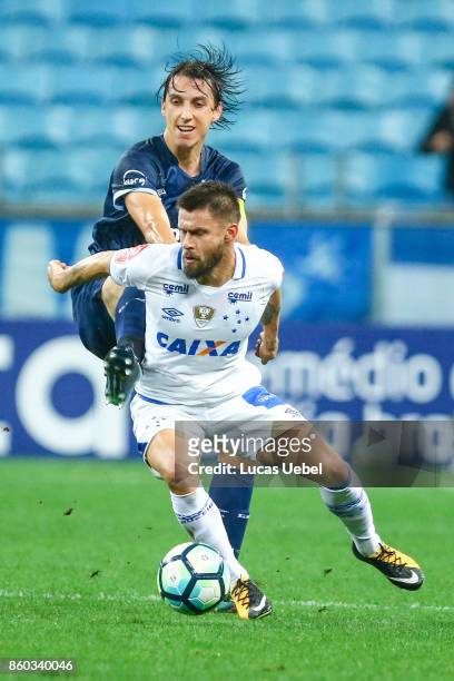 Pedro Geromel of Gremio battles for the ball against Rafael Sobis of Cruzeiro during the match Gremio v Cruzeiro as part of Brasileirao Series A...