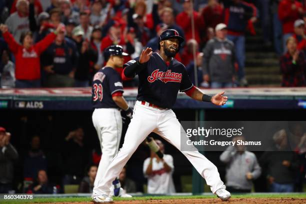 Austin Jackson of the Cleveland Indians celebrates scoring on a single by Roberto Perez in the fifth inning against the New York Yankees in Game Five...