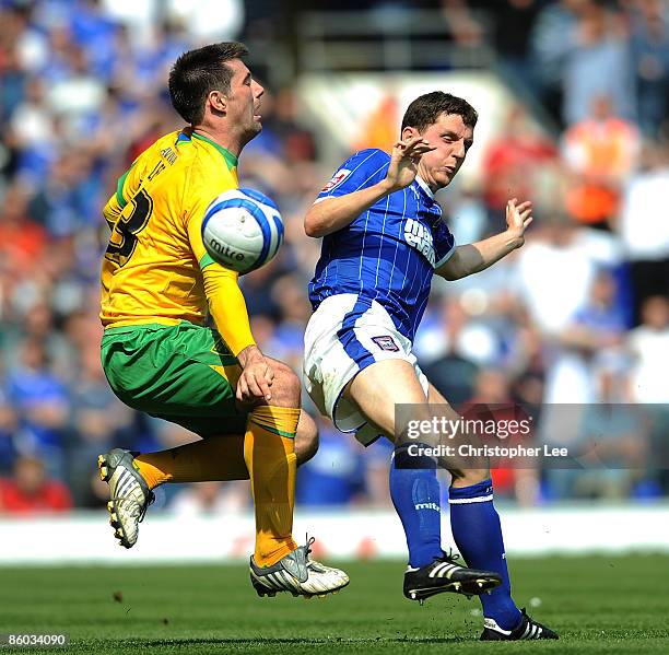 Alex Bruce of Ipswich tackles Alan Lee of Norwich during the Coca-Cola Championship match between Ipswich Town and Norwich City at Portman Road on...