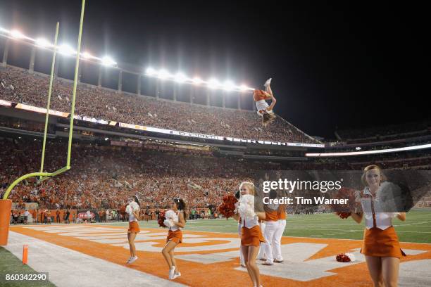 The Texas Longhorns cheerleaders perform during the game against the Kansas State Wildcats at Darrell K Royal-Texas Memorial Stadium on October 7,...