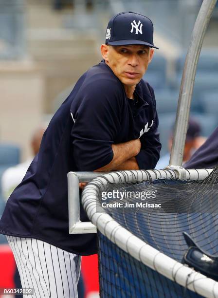 Manager Joe Girardi of the New York Yankees looks on before Game Three of the American League Divisional Series against the Cleveland Indians at...