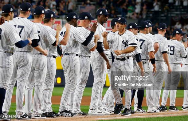 Manager Joe Girardi of the New York Yankees is introduced before Game Three of the American League Divisional Series against the Cleveland Indians at...