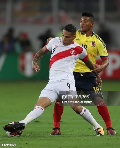 Paolo Guerrero of Peru and Frank Fabra of Colombia fight for the ball during a match between Peru and Colombia as part of FIFA 2018 World Cup...