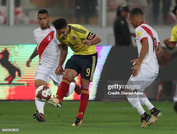 Radamel Falcao of Colombia and Yoshimar Yotun of Peru fight for the ball during a match between Peru and Colombia as part of FIFA 2018 World Cup...