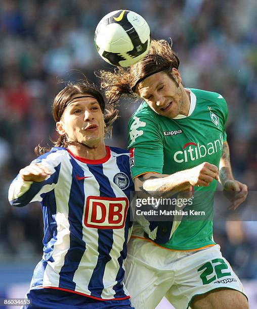 Marko Pantelic of Berlin and Torsten Frings of Bremen jump for a header during the Bundesliga match between Hertha BSC Berlin and SV Werder Bremen at...