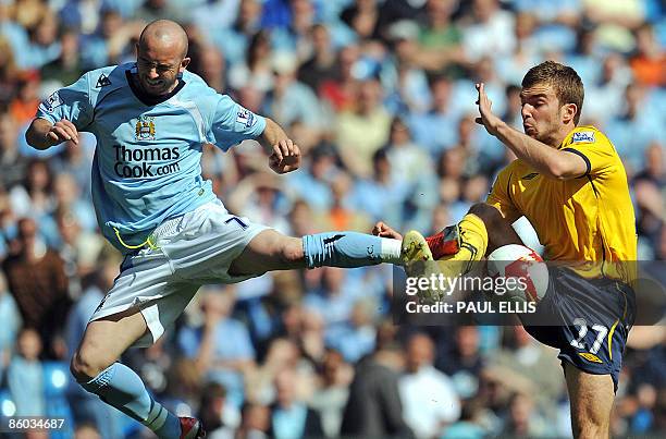 Manchester City's Irish midfielder Stephen Ireland challenges West Bromwich Albion's Scottish midfielder James Morrison during the English Premier...