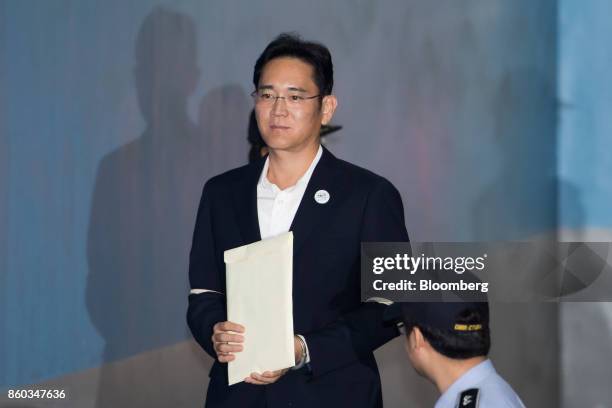 Jay Y. Lee, co-vice chairman of Samsung Electronics Co., arrives at the Seoul Central District Court in Seoul, South Korea, on Thursday, Oct. 12,...