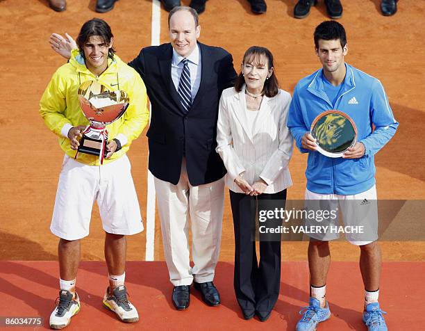 Spanish Rafael Nadal and Serbian Novak Djokovic pose with their trophy, next Prince Albert II of Monaco and Princess Elisabeth-Anne De Massy , at the...