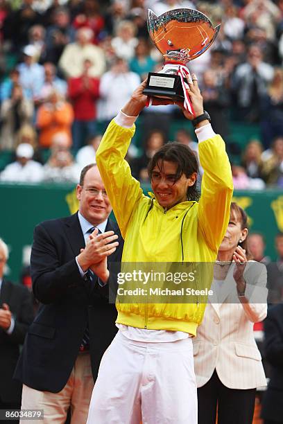 Rafael Nadal of Spain holds aloft the winners trophy as Prince Albert II of Monaco looks on after his 6-3,2-6,6-1 victory in the final match against...