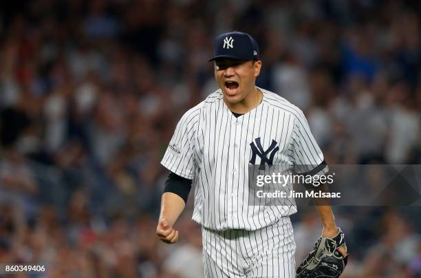 Masahiro Tanaka of the New York Yankees in action against the Cleveland Indians in Game Three of the American League Divisional Series at Yankee...