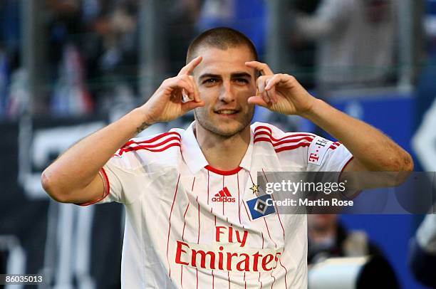 Mladen Petric of Hamburg celebrates after scoring his teams 2nd goal during the Bundesliga match between Hamburger SV and Hannover 96 at the HSH...