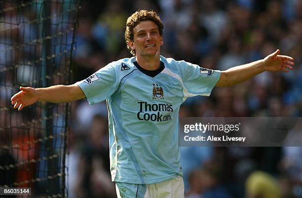 Elano of Manchester City celebrates scoring his team's third goal during the Barclays Premier League match between Manchester City and West Bromwich...