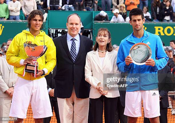 Spanish Rafael Nadal and Serbian Novak Djokovic pose with their trophy, next Prince Albert II of Monaco and Princess Elisabeth-Anne De Massy , at the...