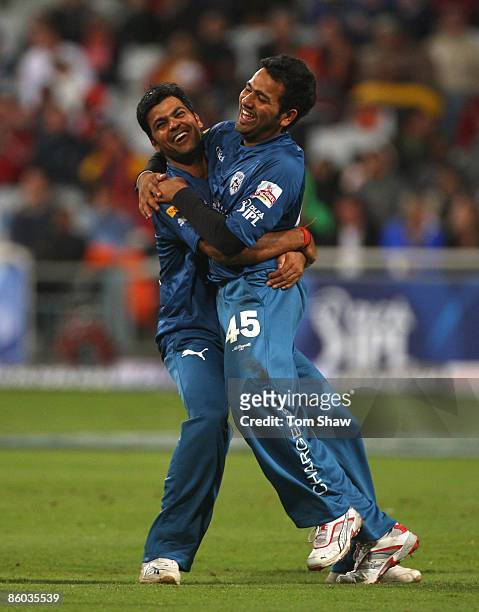 Singh congratulates Rohit Sharma of the Deccan Chargers after running out Ajit Agarkar of Kolkata during the IPL T20 match between Deccan Chargers...
